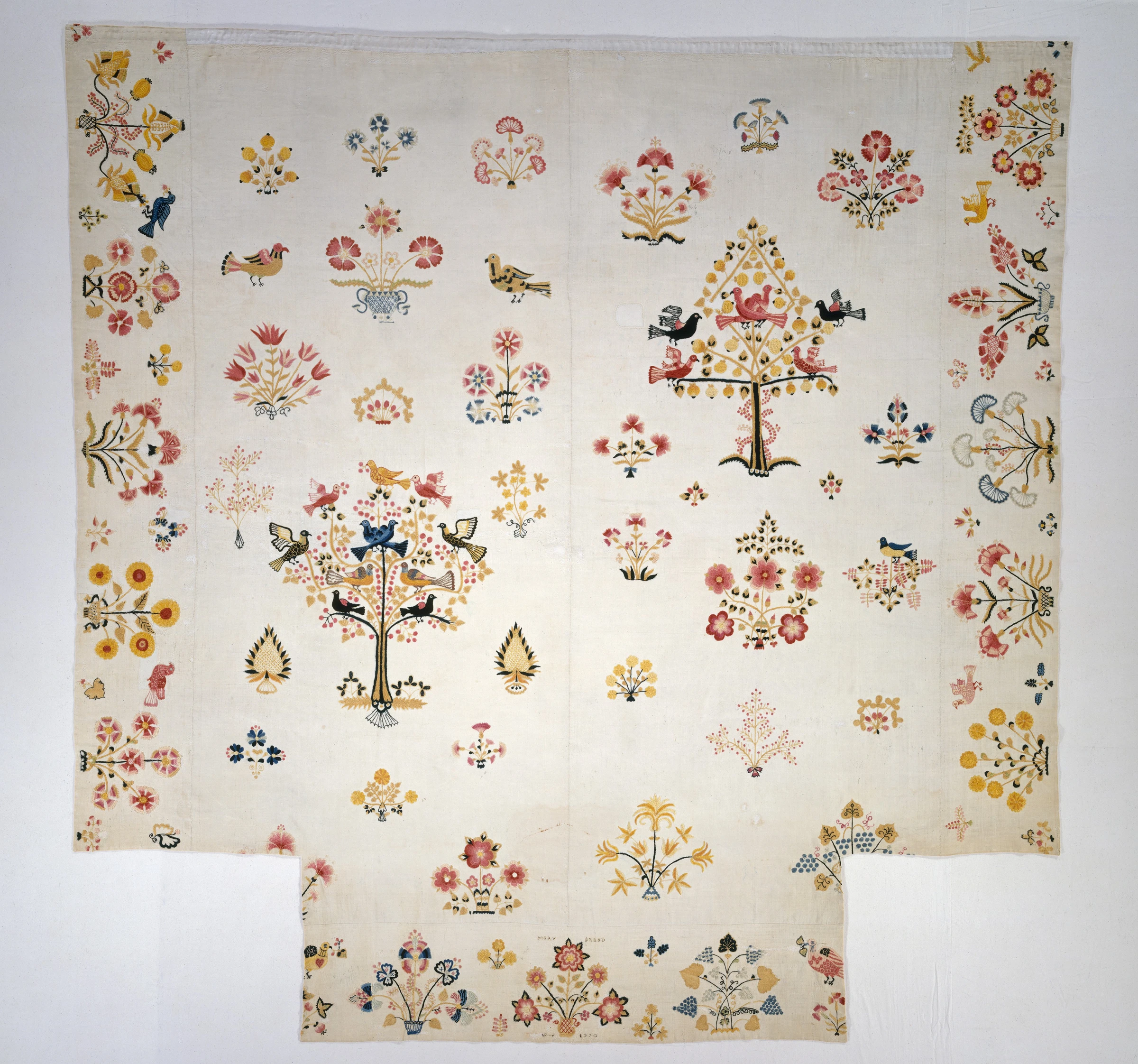 Embroidered coverlet by Mary Breed