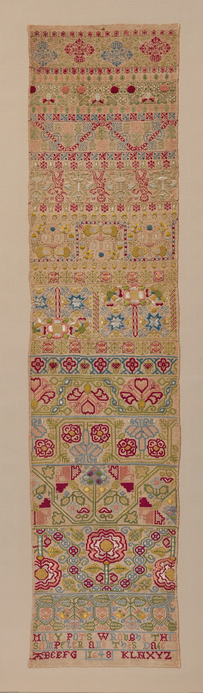Embroidered band sampler by Mary Pots
